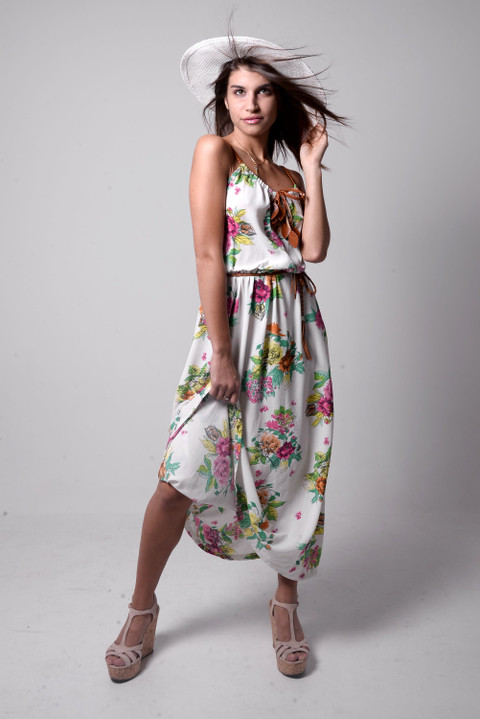A floral maxi dress with a sun hat.