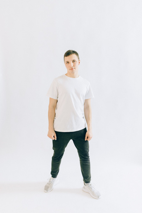 Bottle-green cotton joggers with a white tee.