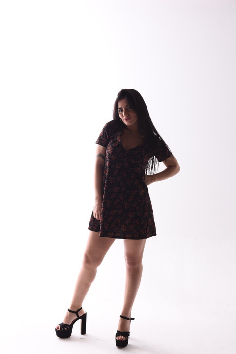 A black ditsy-print mini dress.
