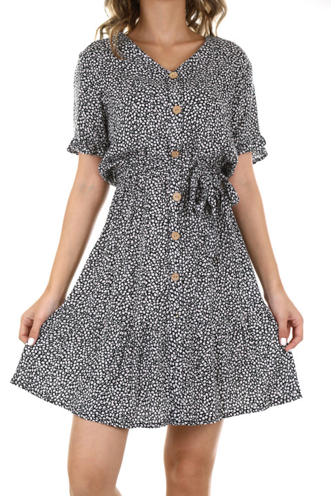 A button-front tea dress in a small print, on white.