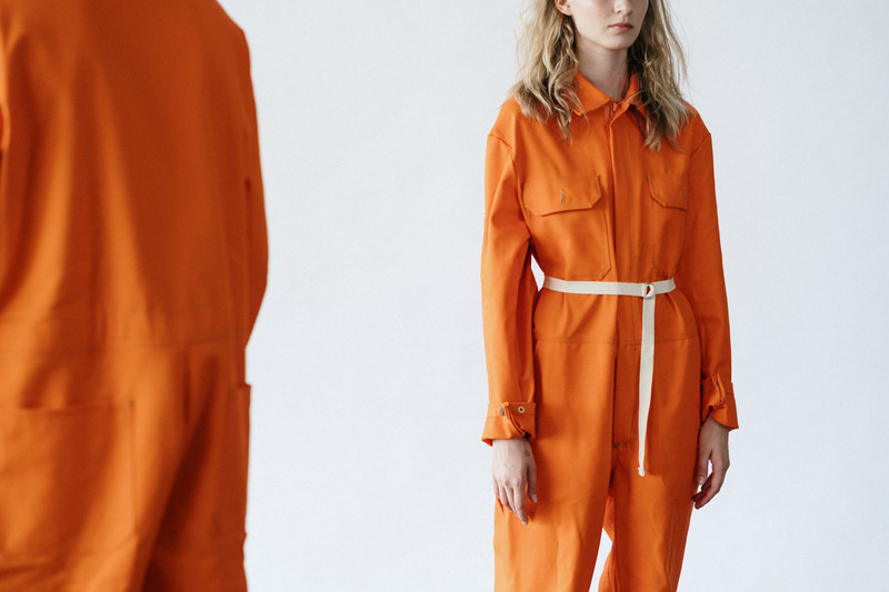 The orange utility jumpsuit, close up.