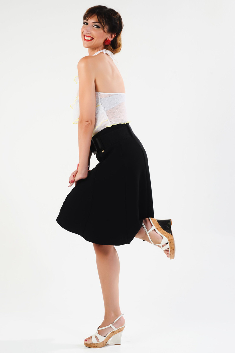 The black skater skirt in a jump.